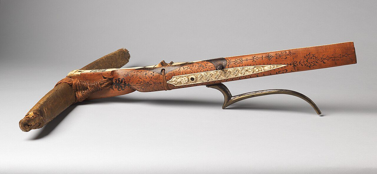 A historic crossbow stock showing the tiller and trigger lever